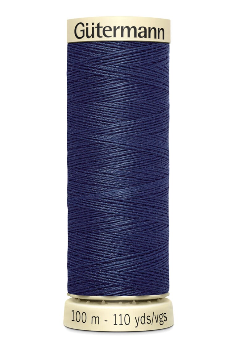 A spool of Gütermann sewing thread in navy blue. The label shows it contains 100 meters (110 yards) of thread. The spool is cylindrical with a beige top and bottom.