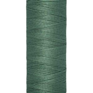 A spool of Gütermann sewing thread in dark green, labeled with "100 m - 110 yds" on the base. The spool is cylindrical with a beige top and bottom.