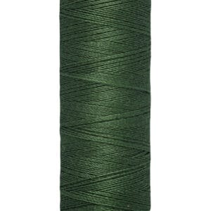 A spool of Gütermann green sewing thread with 100 meters (110 yards) capacity, shown against a white background. The label is cream-colored with black text displaying the brand name and thread length.