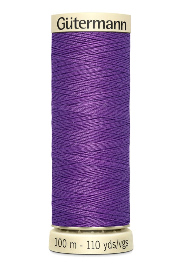 A spool of Gütermann sewing thread in vibrant purple. The cylindrical spool is labeled with "Gütermann" at the top and shows the length as 100 meters or 110 yards at the base.