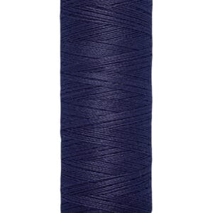 Spool of Gütermann navy blue thread with cream-colored top and bottom. The label reads "100 m - 110 yds.