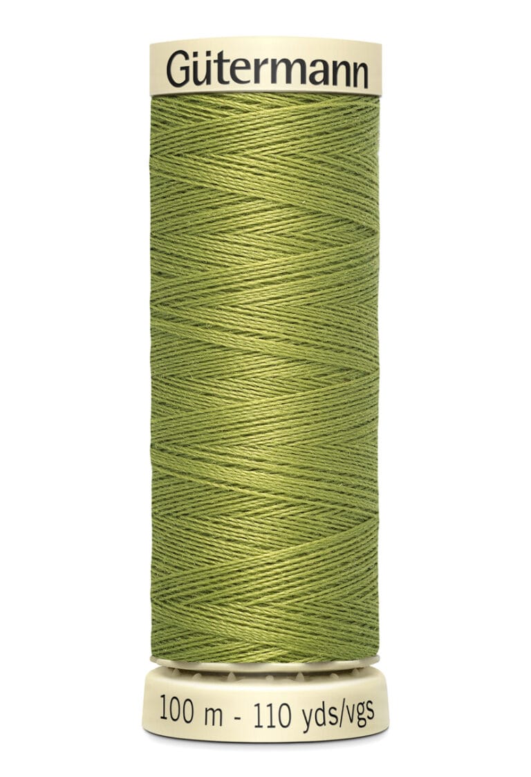 A spool of Gütermann thread in light green, wrapped neatly around the spool. The label indicates 100 meters or 110 yards. The top and bottom of the spool are cream-colored.