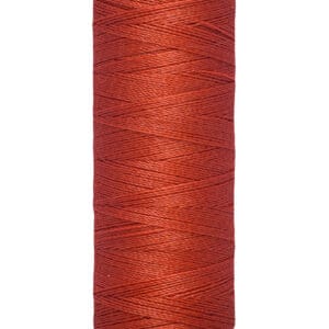 Spool of Gütermann red thread, labeled 100 meters and 110 yards.