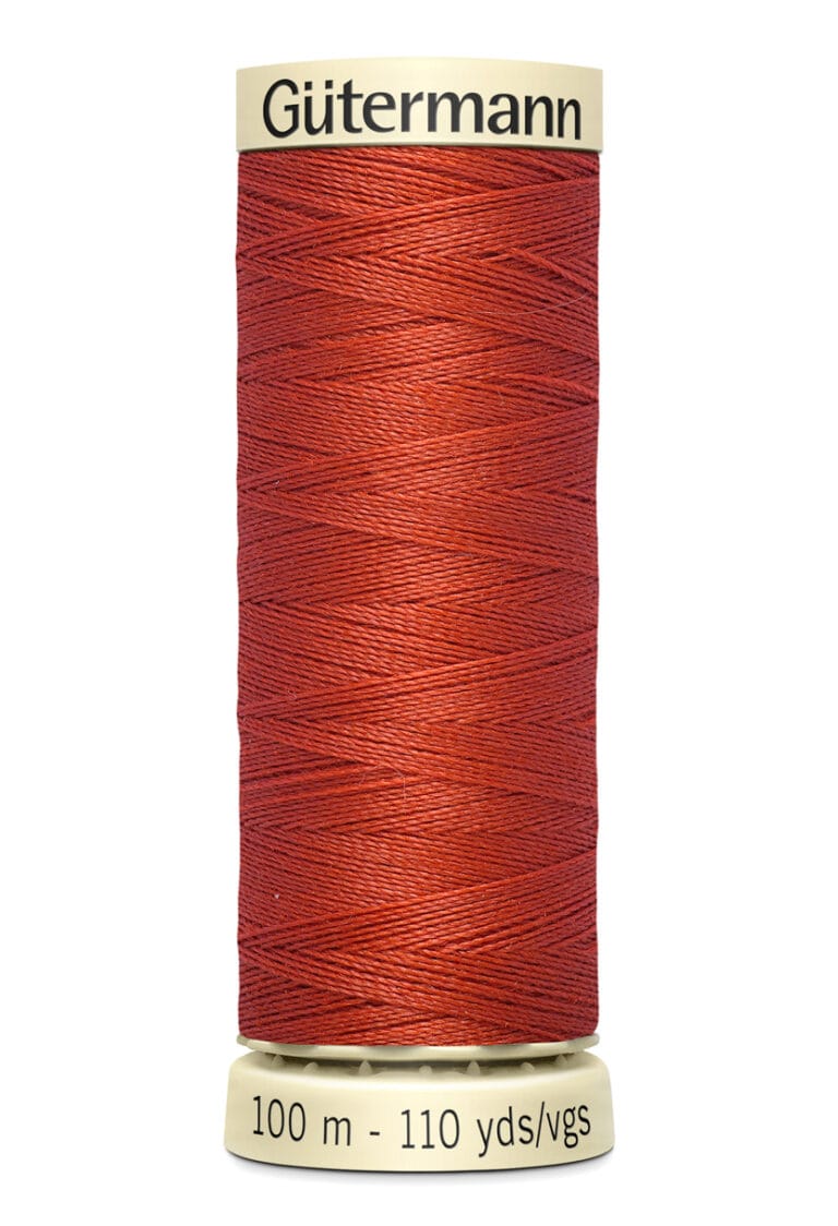 Spool of Gütermann red thread, labeled 100 meters and 110 yards.