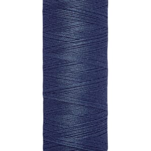 A spool of Gütermann sewing thread in dark blue. The label indicates it contains 100 meters or 110 yards of thread. The spool has a yellowish base and top.