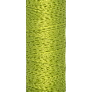 A spool of Gütermann sewing thread in bright green, labeled with "100 m - 110 yds/vgs." The spool has a cream-colored top and bottom, and the thread is tightly wound.