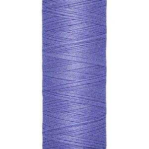 Spool of Gütermann polyester thread in lavender, wrapped around a beige spool. The label indicates 100 meters and 110 yards.
