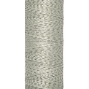 Spool of Gütermann sewing thread with light gray color, displaying text "100 m - 110 yds/vgs" at the base.
