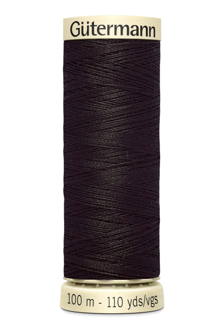 A spool of Gütermann sewing thread in dark brown. The spool is labeled with "Gütermann" at the top and "100 m - 110 yds/vgs" at the bottom. The thread is tightly wound around the beige spool.