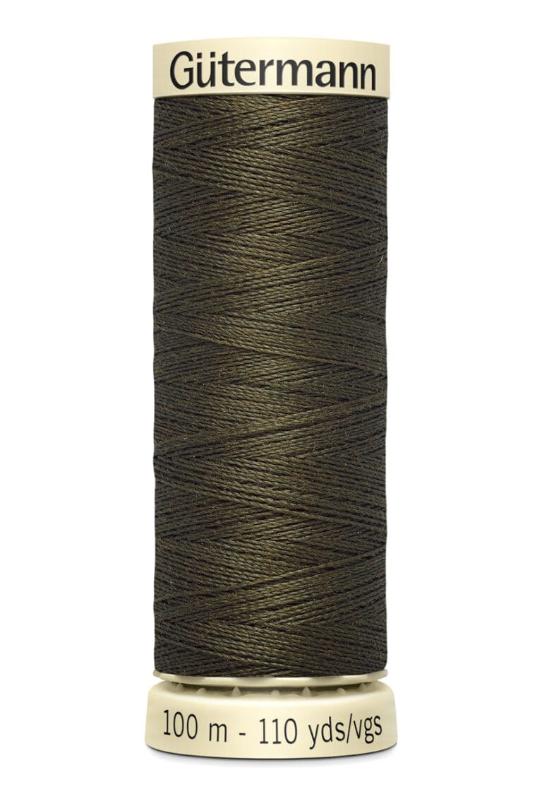 A spool of Gütermann sewing thread in dark olive green is displayed. The spool is beige, marked with "Gütermann" on the top and "100 m - 110 yds/vgs" on the bottom. The thread is neatly wound around the spool.