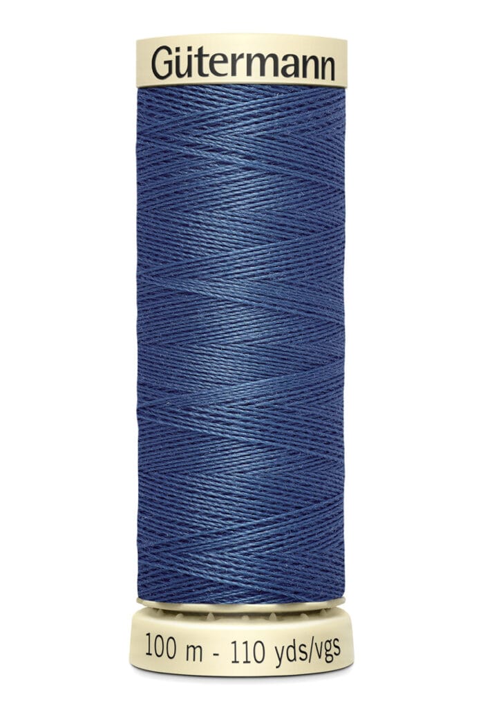 A spool of Gütermann dark blue thread, labeled with "100 m - 110 yds" on the bottom and "Gütermann" on the top, displayed against a white background.