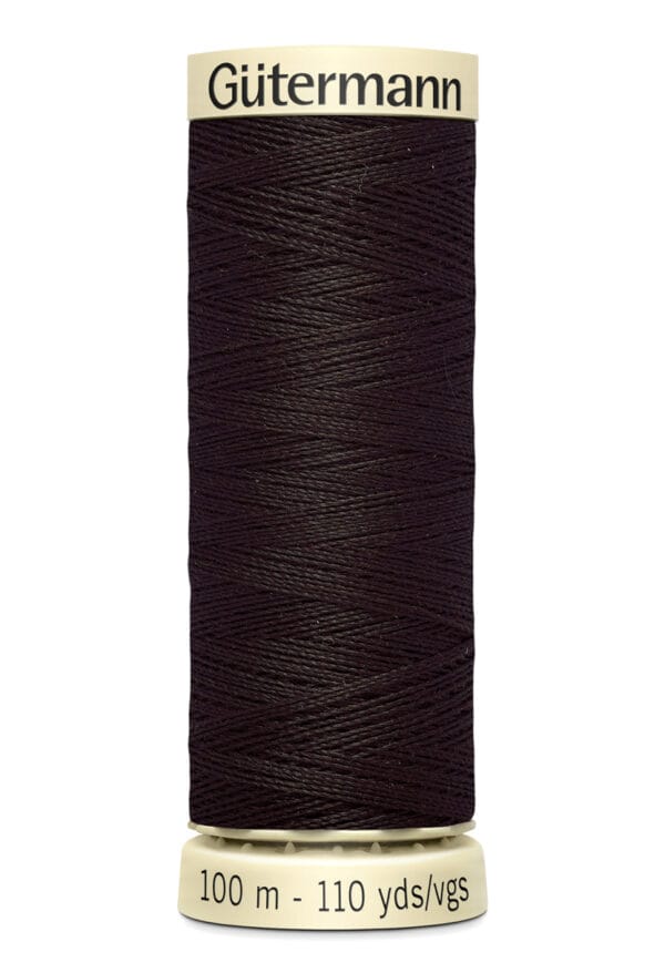 A spool of Gütermann sewing thread in dark brown. It holds 100 meters (110 yards) of thread and has beige ends with brand and length details printed in black.