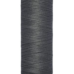 A spool of Gütermann sewing thread in dark gray, with labels indicating it contains 100 meters or 110 yards. The spool has a beige top and bottom with black text.