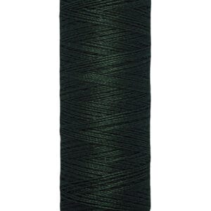 A spool of Gütermann dark green thread, labeled 100 meters or 110 yards, on a light-colored spool.