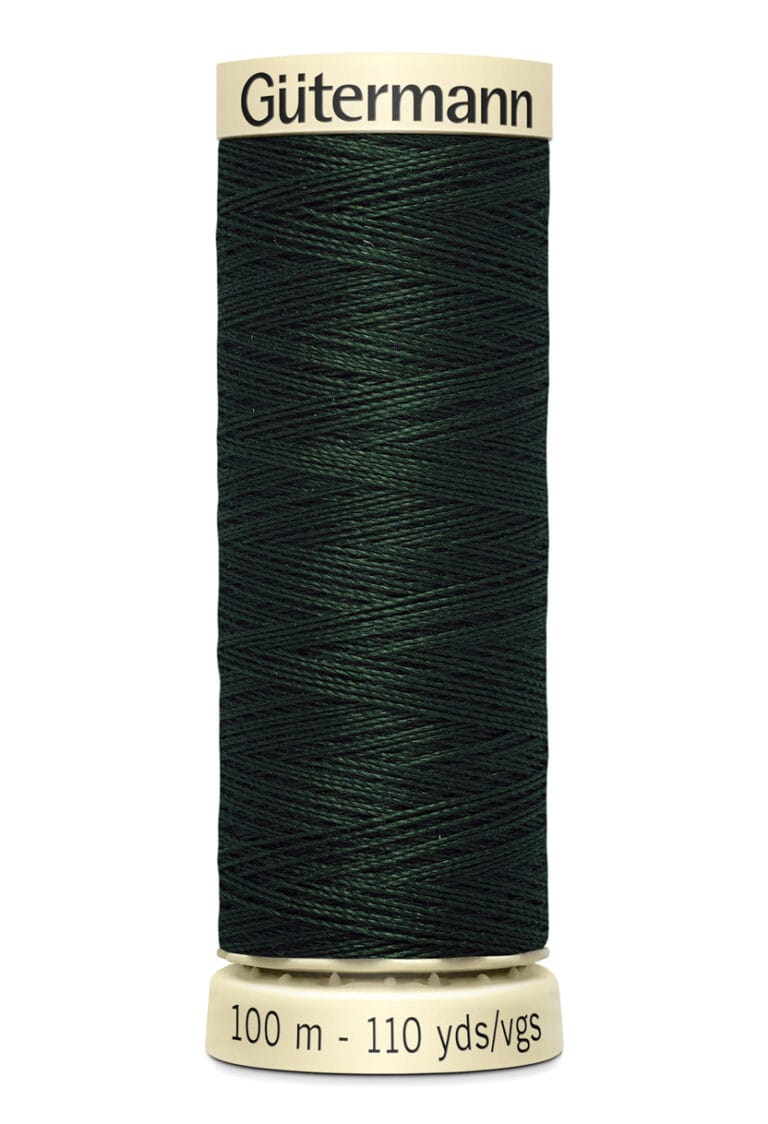 A spool of Gütermann dark green thread, labeled 100 meters or 110 yards, on a light-colored spool.