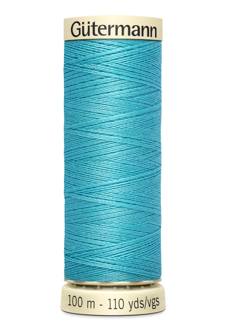 A spool of Gütermann sewing thread in bright turquoise. The label shows 100 meters and 110 yards. The spool is beige with the brand name at the top. The thread is neatly wound around the spool.