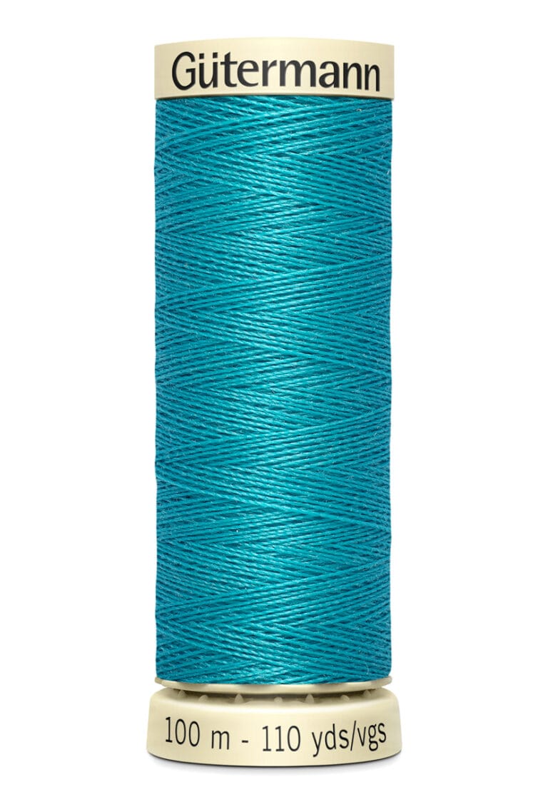 A spool of Gütermann sewing thread in bright turquoise. The spool's label is beige, indicating 100 meters or 110 yards. The thread is tightly wound around the spool, showcasing its vibrant color.