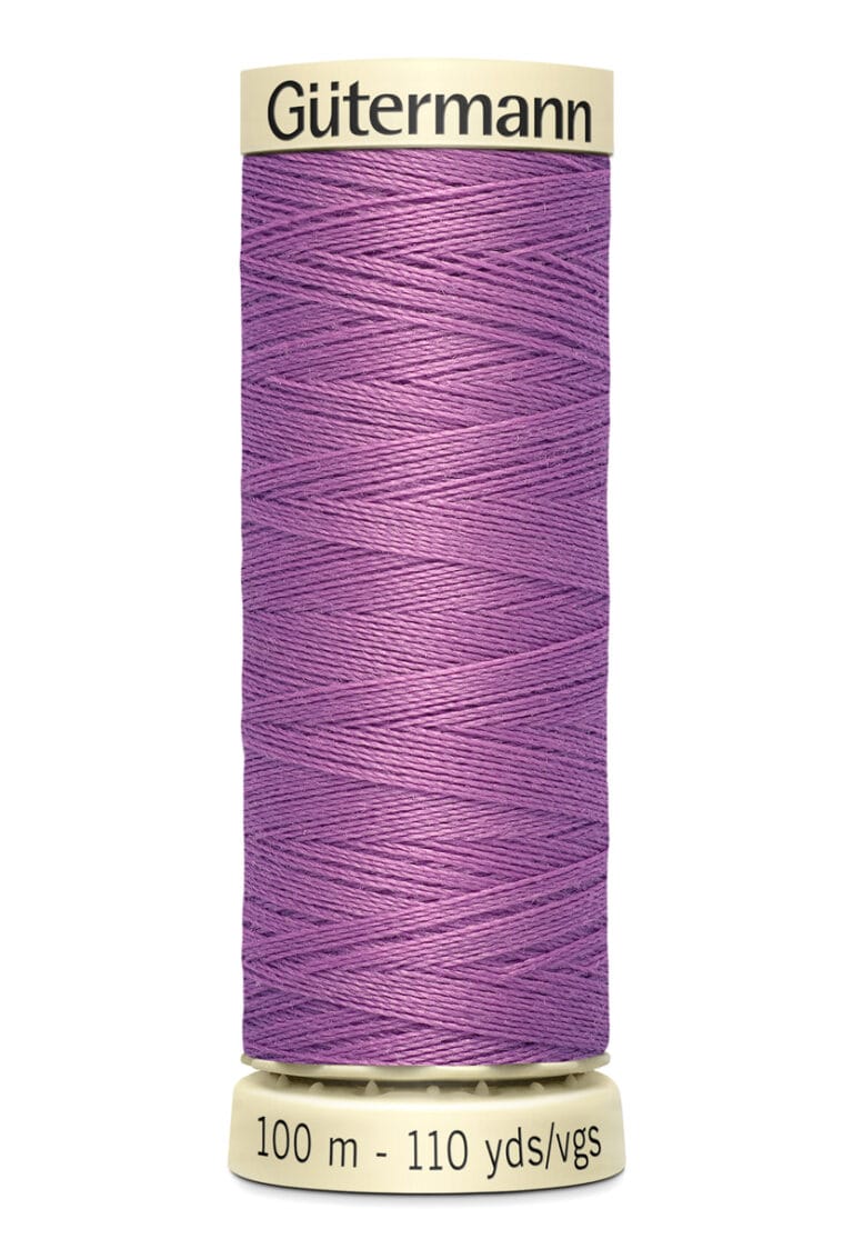 A spool of Gütermann sewing thread in a vibrant purple color, labeled with "100 m - 110 yds/vgs" at the bottom. The spool has a cream-colored top and base.