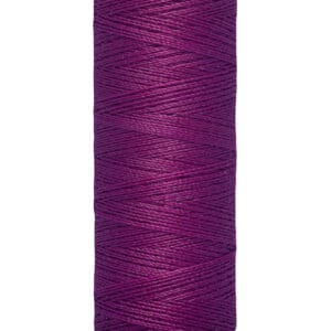 A spool of Gütermann sewing thread in a rich purple color. The label indicates it is 100 meters (110 yards) long.