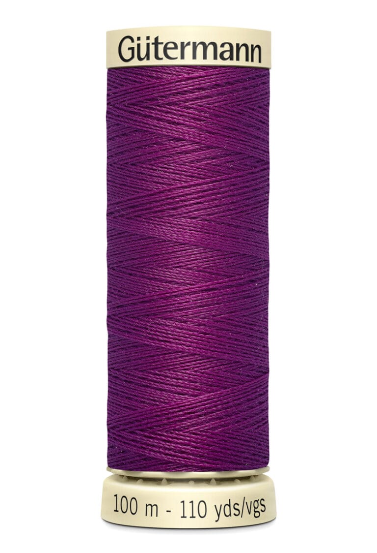 A spool of Gütermann sewing thread in a rich purple color. The label indicates it is 100 meters (110 yards) long.