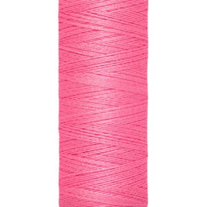 A spool of Gütermann thread in bright pink, with measurements of 100 meters and 110 yards printed on the label. The spool is upright, showing the thread wound neatly around it.