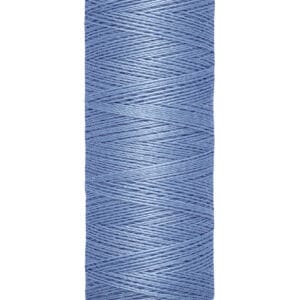 A spool of Gütermann thread in light blue, with 100 meters (110 yards) indicated on the base. The thread is neatly wound on an off-white spool.