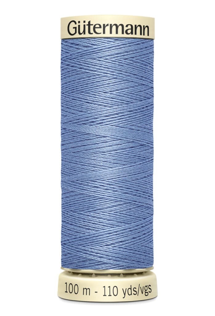 A spool of Gütermann thread in light blue, with 100 meters (110 yards) indicated on the base. The thread is neatly wound on an off-white spool.