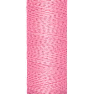 A spool of Gütermann pink sewing thread, labeled with 100 meters and 110 yards on the base.
