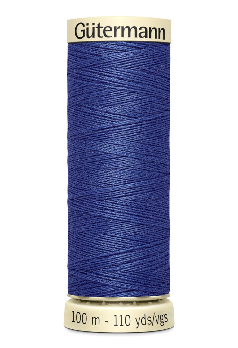 A spool of Gütermann thread, displaying deep blue color, is shown standing vertically. The label indicates it contains 100 meters (110 yards) of thread.