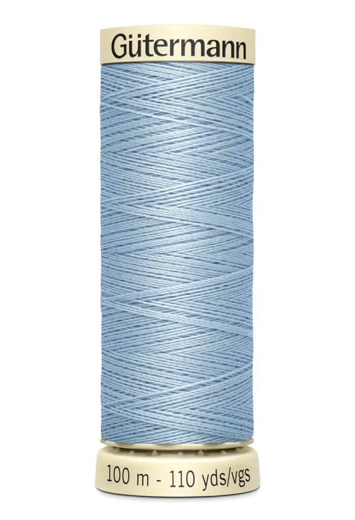 Spool of Gütermann thread in light blue. The label displays length: 100 meters or 110 yards.
