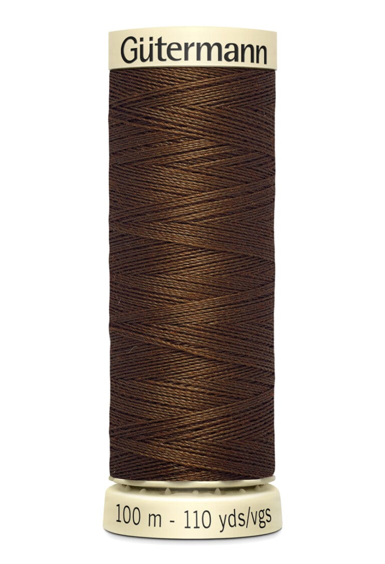 A spool of Gütermann brown thread, labeled with "100 m - 110 yds/vgs," against a white background. The spool has a beige top and bottom with the brand name in black.