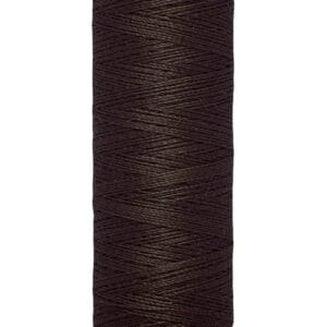 A spool of Gütermann thread in dark brown, labeled with "100 m - 110 yds." The thread is tightly wound on a beige cylindrical holder with the Gütermann brand name at the top.