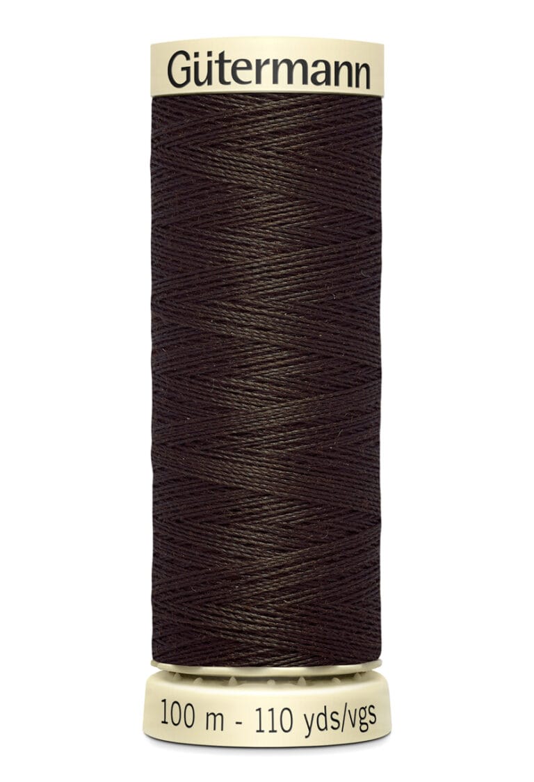 A spool of Gütermann thread in dark brown, labeled with "100 m - 110 yds." The thread is tightly wound on a beige cylindrical holder with the Gütermann brand name at the top.