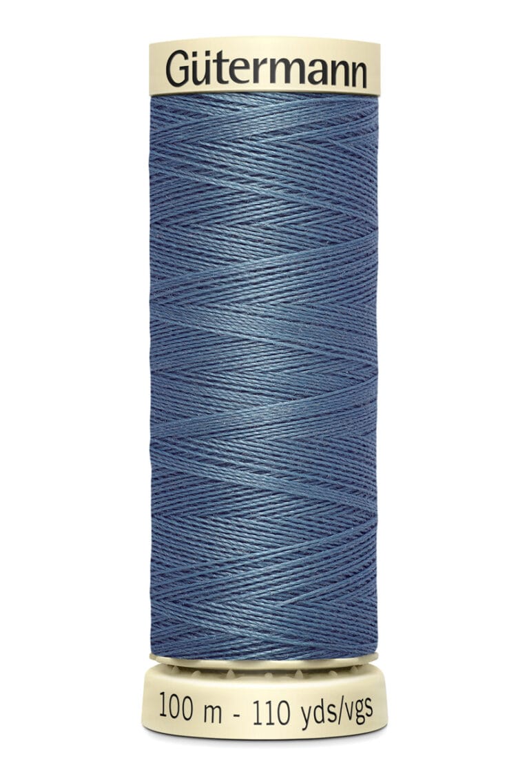 A spool of Gütermann thread in blue, wound tightly with a smooth appearance. The spool label reads "100 m - 110 yds/vgs," and the top label displays the brand name.