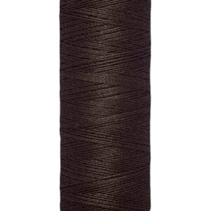 A spool of Gütermann dark brown thread, labeled "100 m - 110 yds/vgs," is shown upright against a white background.