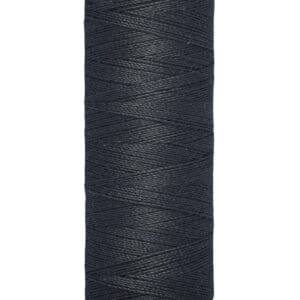 A spool of Gütermann black sewing thread, measuring 100 meters or 110 yards, is displayed against a white background. The thread is tightly wound around a beige spool.