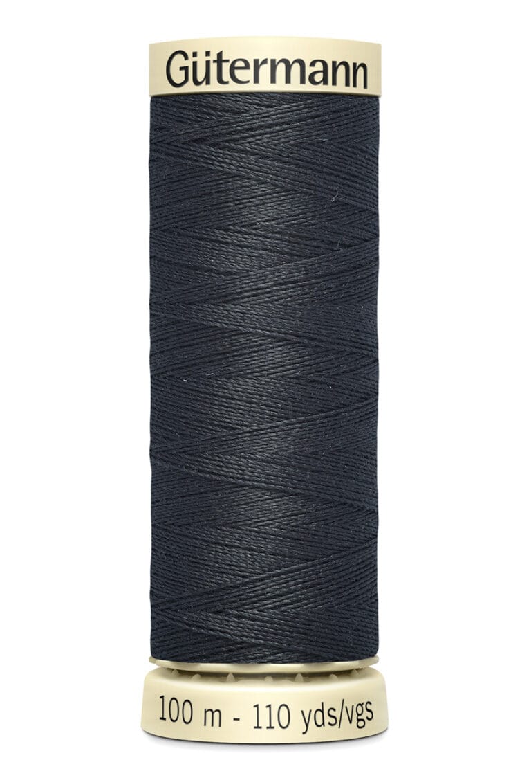 A spool of Gütermann black sewing thread, measuring 100 meters or 110 yards, is displayed against a white background. The thread is tightly wound around a beige spool.