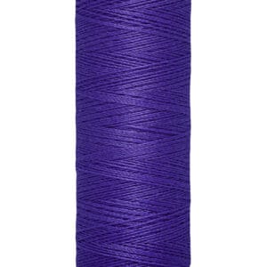 A spool of Gütermann thread with a deep purple color. It is marked with "100 m - 110 yds" on the bottom. The thread is neatly wound around a beige spool.