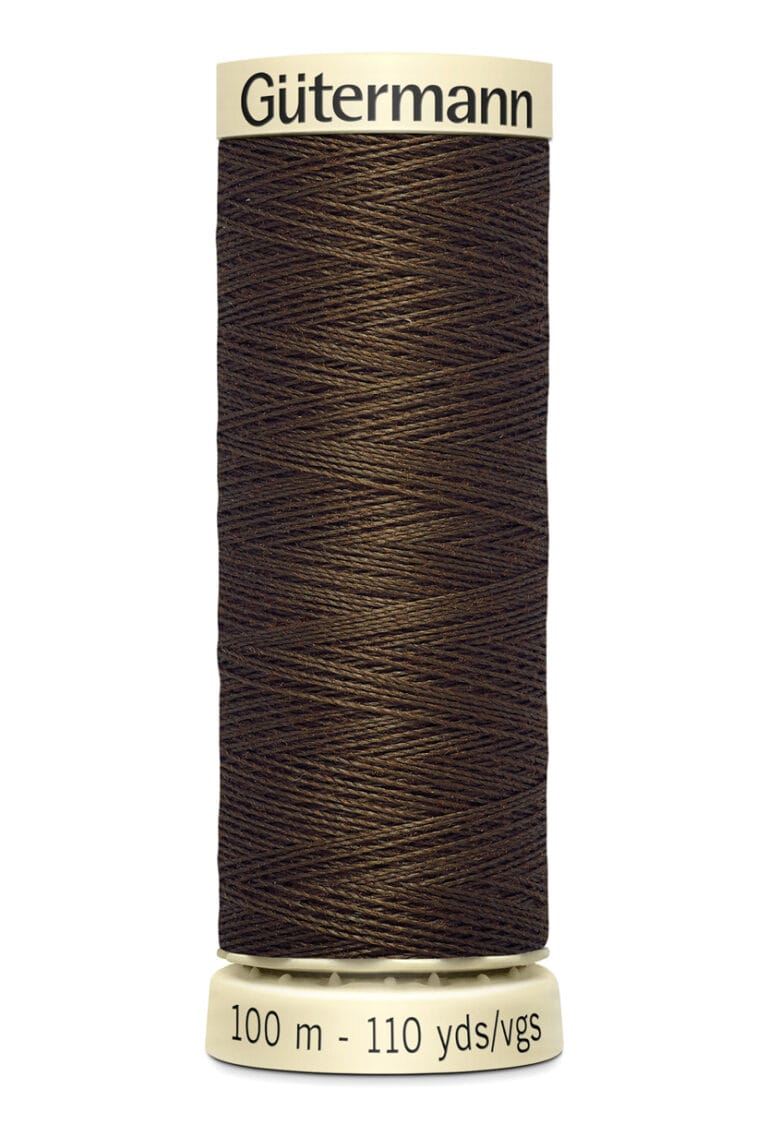 A spool of Gütermann brown thread, with 100 meters or 110 yards labeled on the base, designed for sewing. The spool is upright, displaying tightly wound thread against a white background.