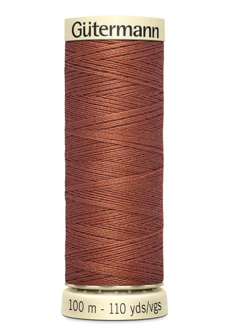 A light brown spool of Gütermann sewing thread, labeled with "100 m - 110 yds/vgs" on the bottom.