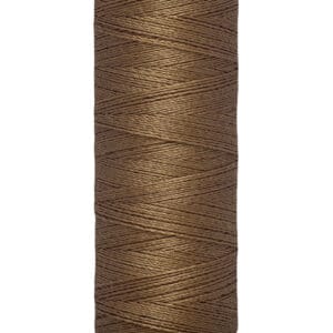 A spool of Gütermann sewing thread in brown color, with a length of 100 meters (110 yards). The spool is cylindrical and labeled at the base with the thread length.