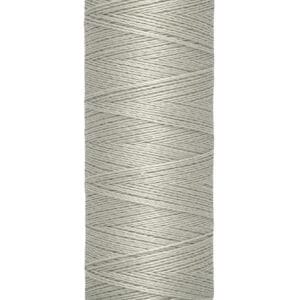 A spool of Gutermann thread in light gray color, with labels indicating 100 meters and 110 yards/vgs of length.