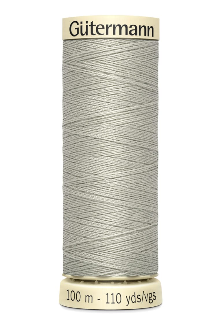 A spool of Gutermann thread in light gray color, with labels indicating 100 meters and 110 yards/vgs of length.