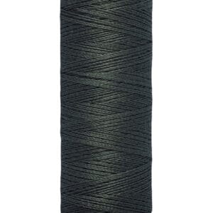 A spool of dark green Gütermann thread labeled with "100 m - 110 yds" on a cream-colored base, designed for sewing and craft projects. The thread is tightly wound around the spool.