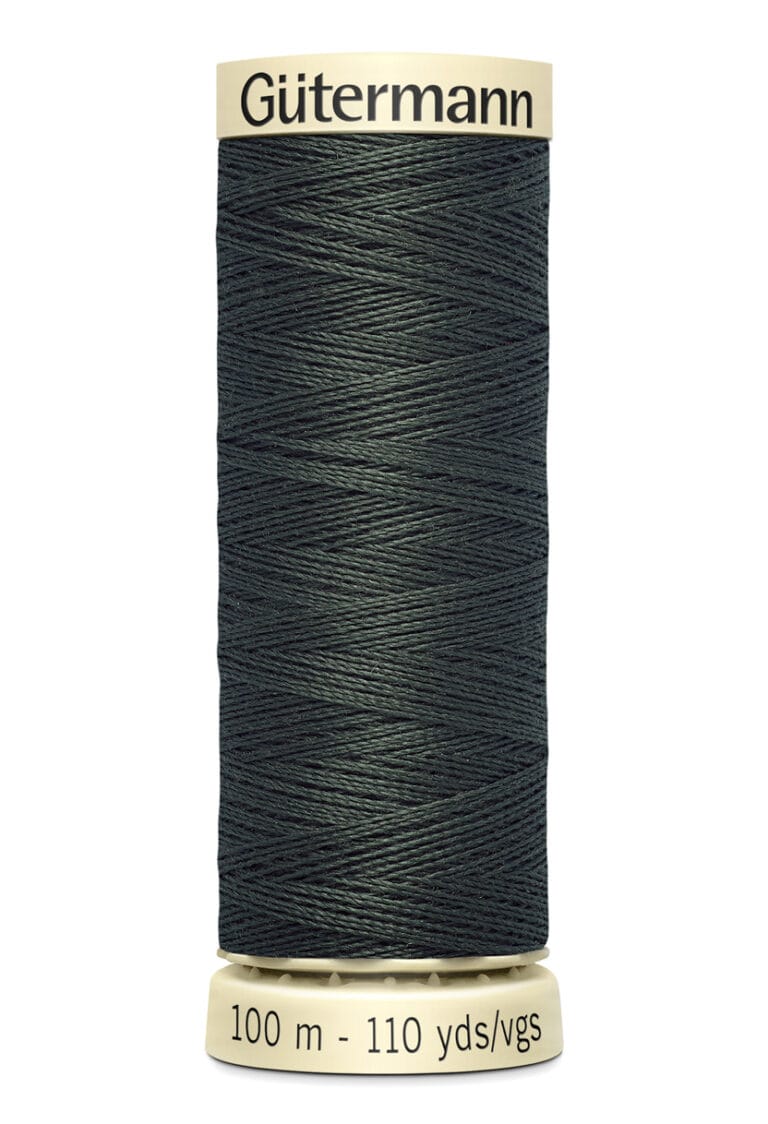 A spool of dark green Gütermann thread labeled with "100 m - 110 yds" on a cream-colored base, designed for sewing and craft projects. The thread is tightly wound around the spool.