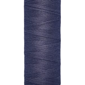 Spool of Gütermann blue thread, labeled 100 meters - 110 yards/vgs, with beige ends.