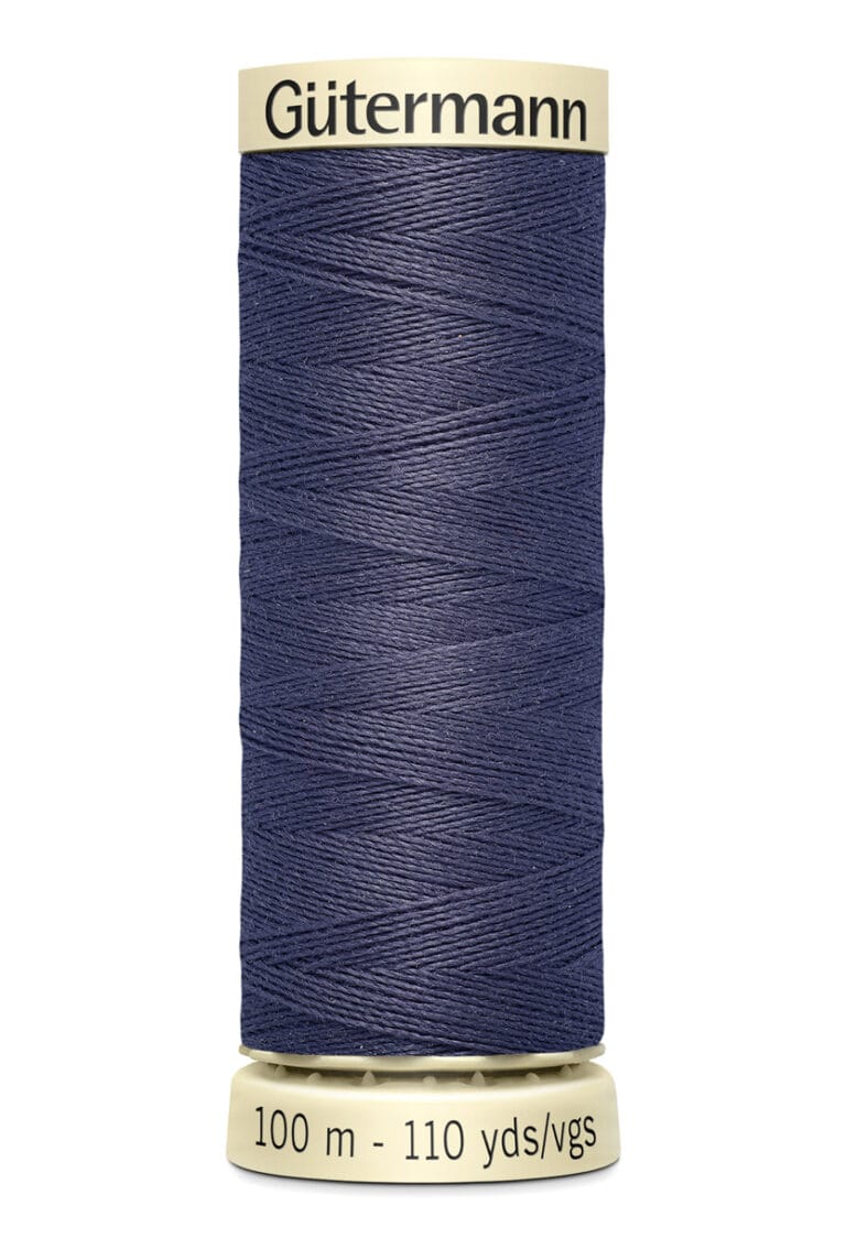 Spool of Gütermann blue thread, labeled 100 meters - 110 yards/vgs, with beige ends.