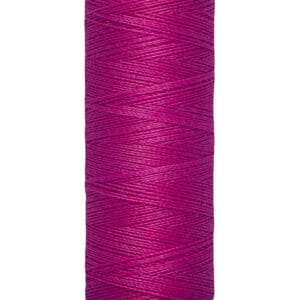 Spool of Gütermann sewing thread in a vibrant magenta color. The label indicates a length of 100 meters or 110 yards.