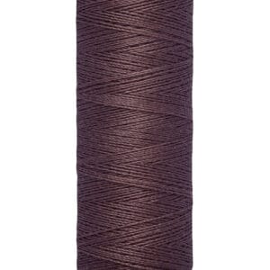 A spool of Gütermann sewing thread with a dark brown color. The spool is labeled with "100 m - 110 yds/vgs" indicating the thread's length.