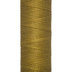 A spool of Gütermann thread in a rich golden brown color. The label indicates it contains 100 meters or 110 yards of thread.